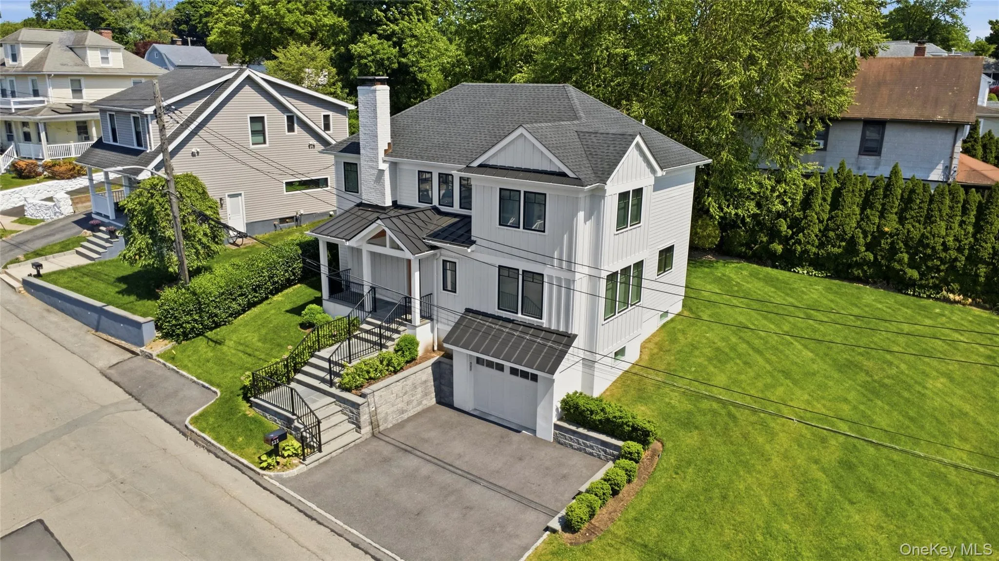 Modern farmhouse set on spacious 9,369 sq ft corner double lot. Modern farmhouse set on spacious 9,369 sq ft corner double lot.
