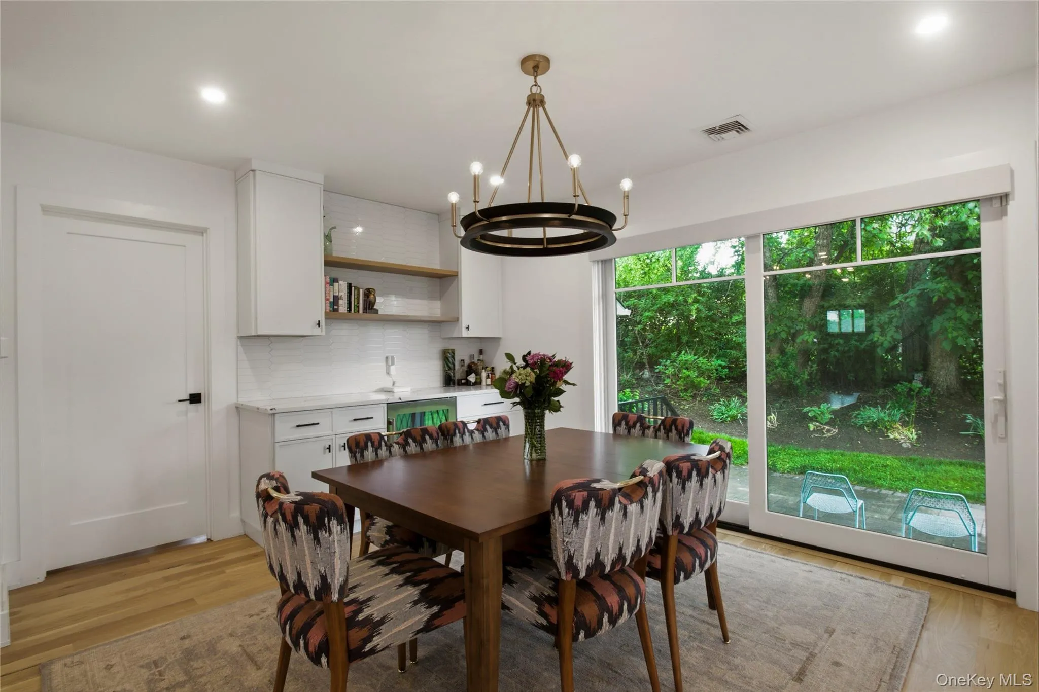 Dining area with sliding doors to patio. Dining area with sliding doors to patio.