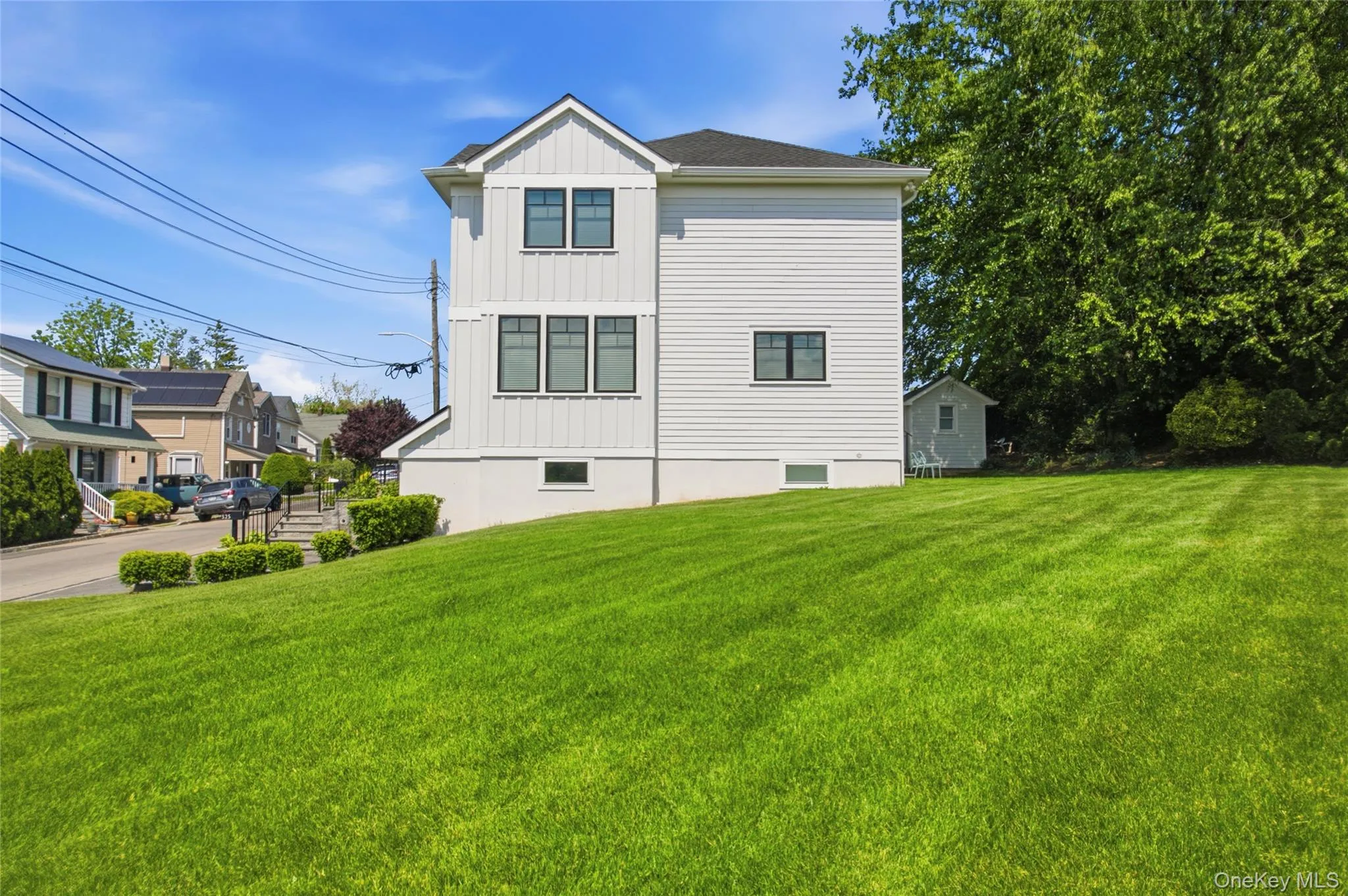 Modern farmhouse set on spacious 9,369 sq ft corner double lot. Modern farmhouse set on spacious 9,369 sq ft corner double lot.