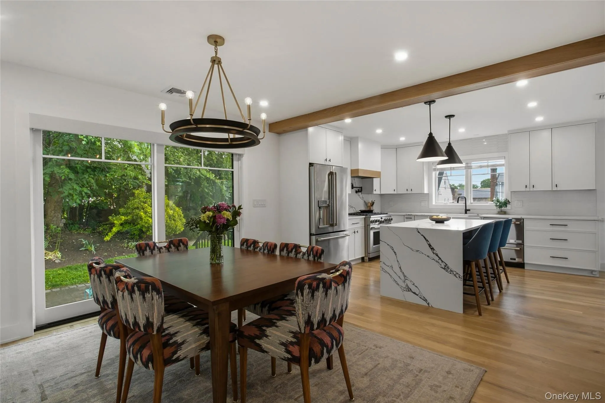 Open kitchen and dining area with access to backyard. Open kitchen and dining area with access to backyard.