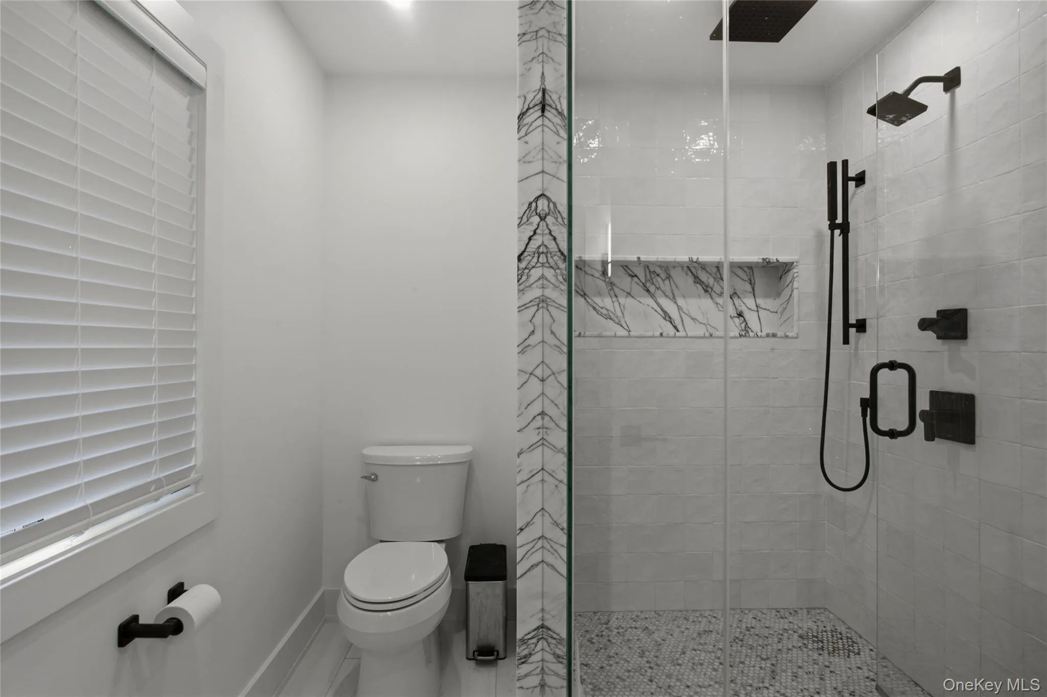 Primary bath with walk-in shower and rainfall showerhead. Primary bath with walk-in shower and rainfall showerhead.