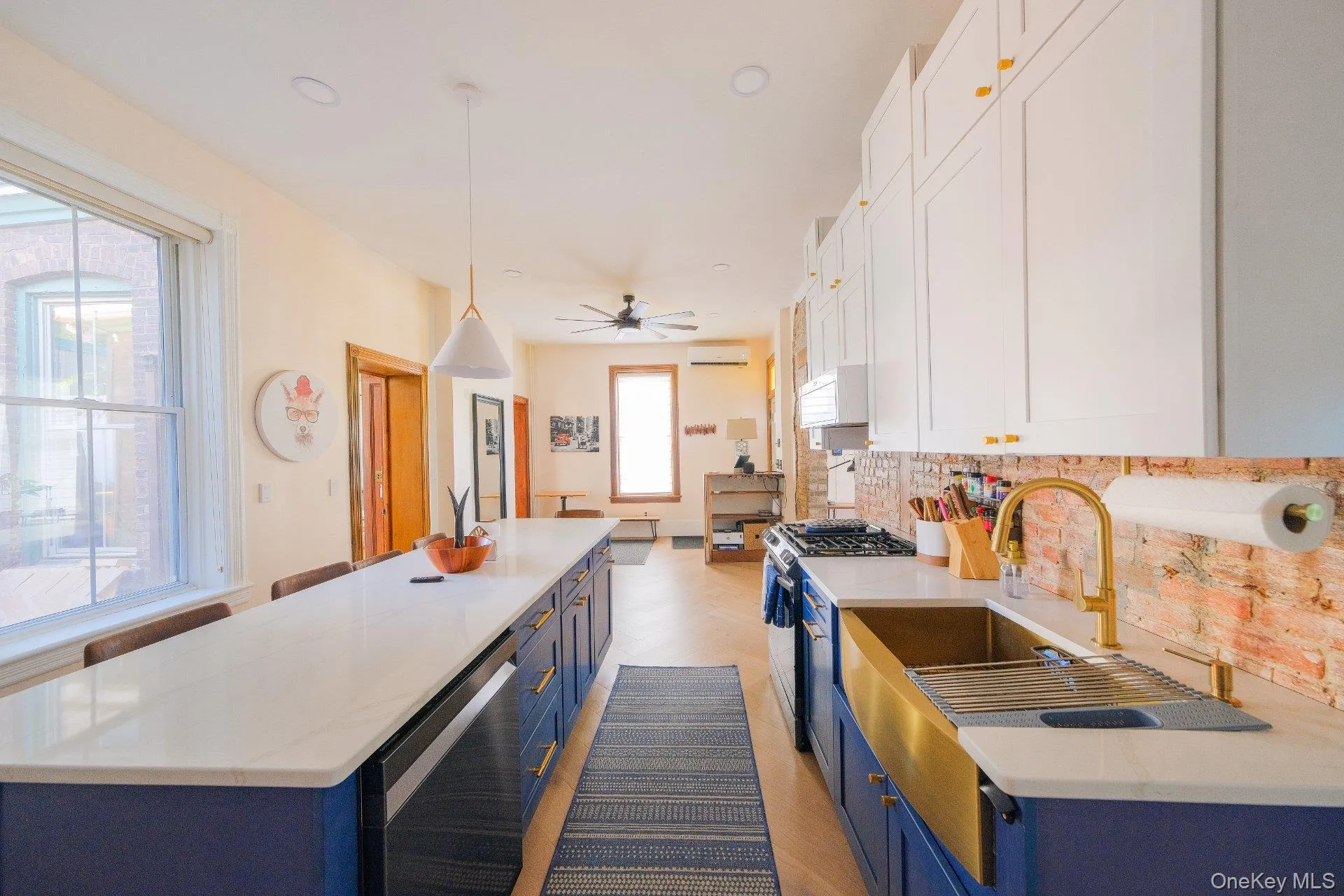 Elongated kitchen island with a light-toned countertop Elongated kitchen island with a light-toned countertop