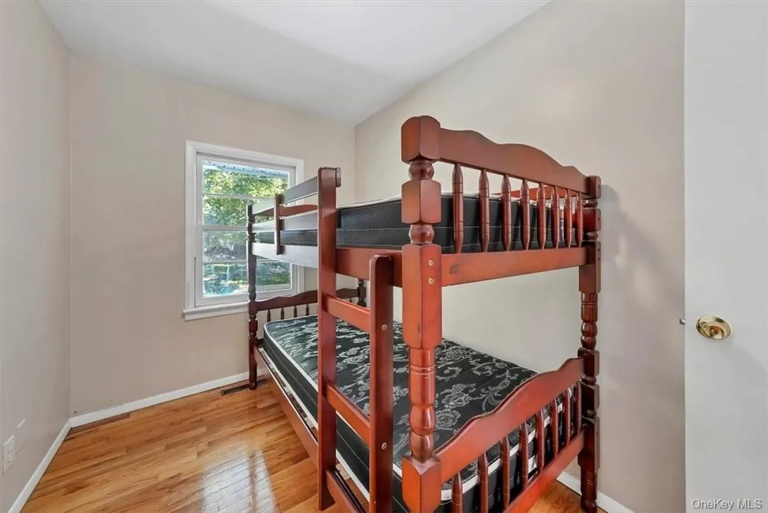 Bedroom 3 with light hardwood / wood-style floors Bedroom 3 with light hardwood / wood-style floors