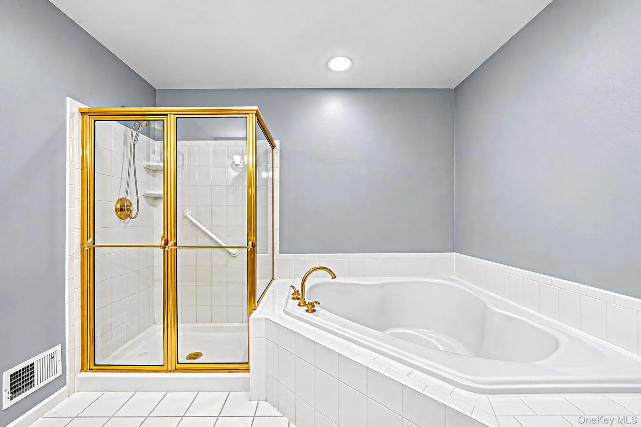 Primary bathroom with shower stall and large tub Primary bathroom with shower stall and large tub