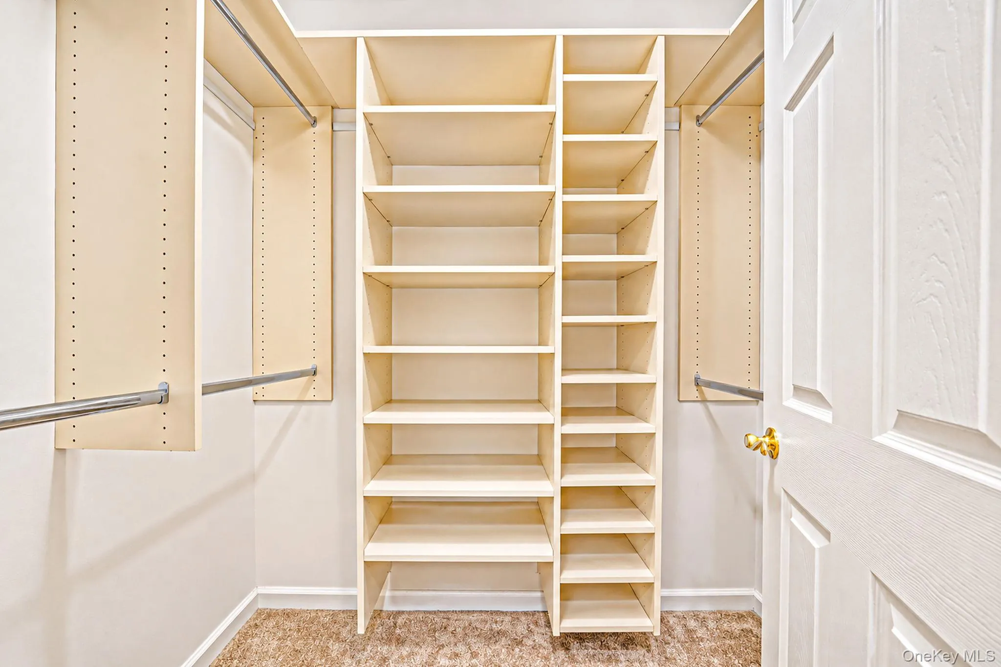 Primary closets with custom organizers Primary closets with custom organizers