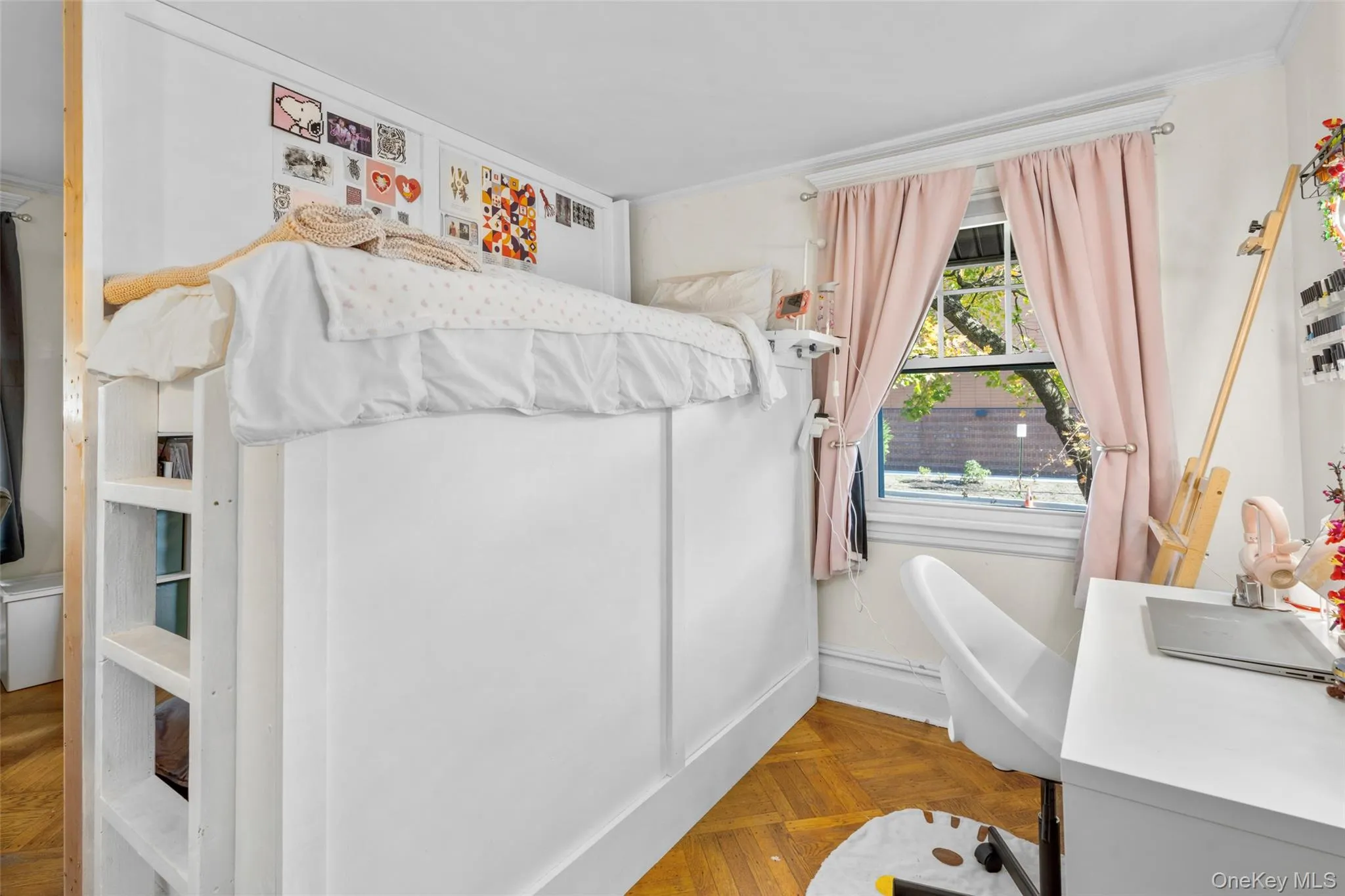 Bedroom featuring parquet flooring and crown molding Bedroom featuring parquet flooring and crown molding