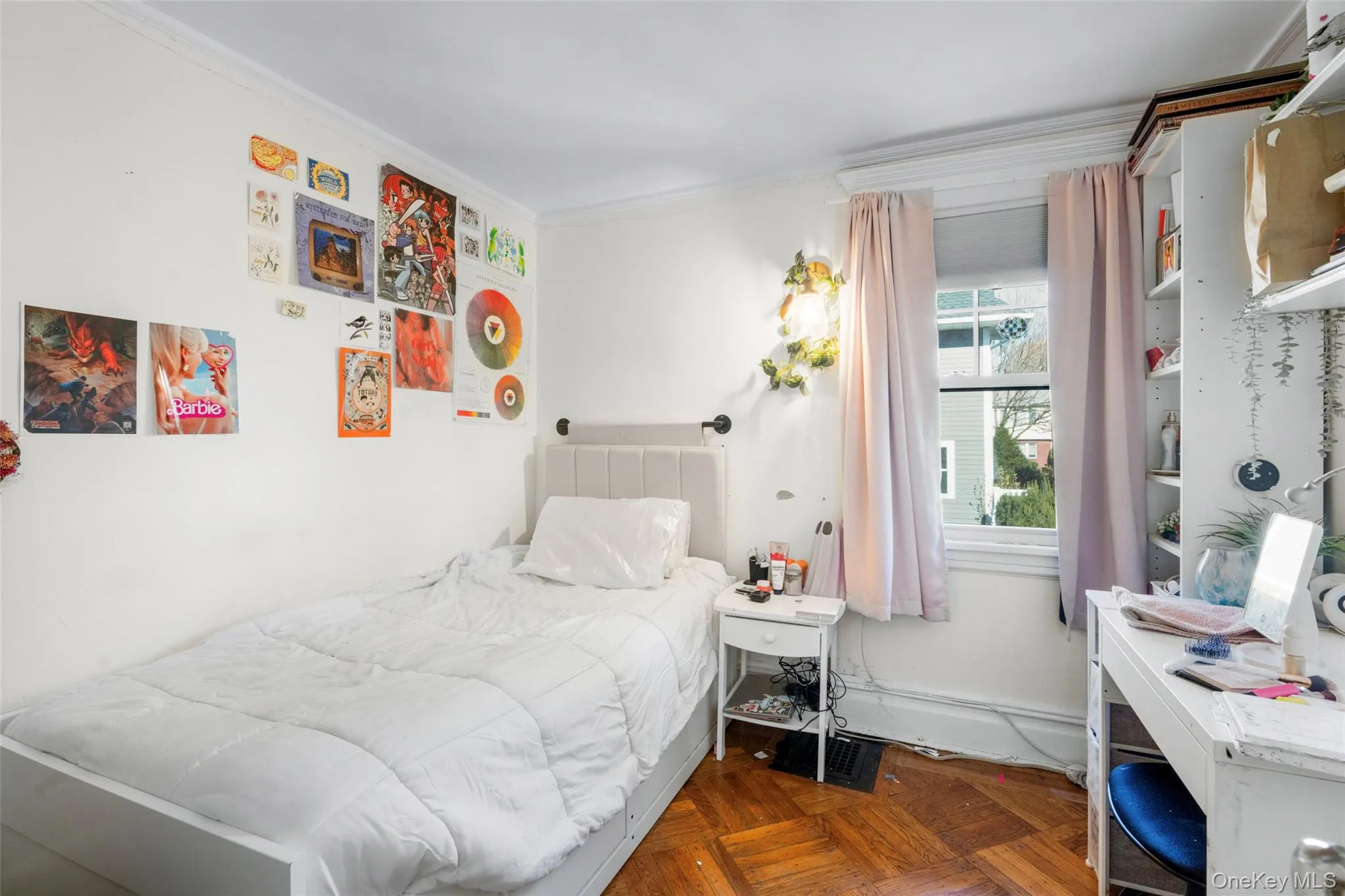 Bedroom featuring parquet flooring and crown molding Bedroom featuring parquet flooring and crown molding