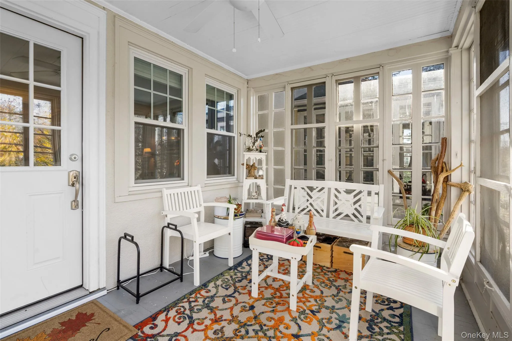 Sunroom featuring ceiling fan Sunroom featuring ceiling fan
