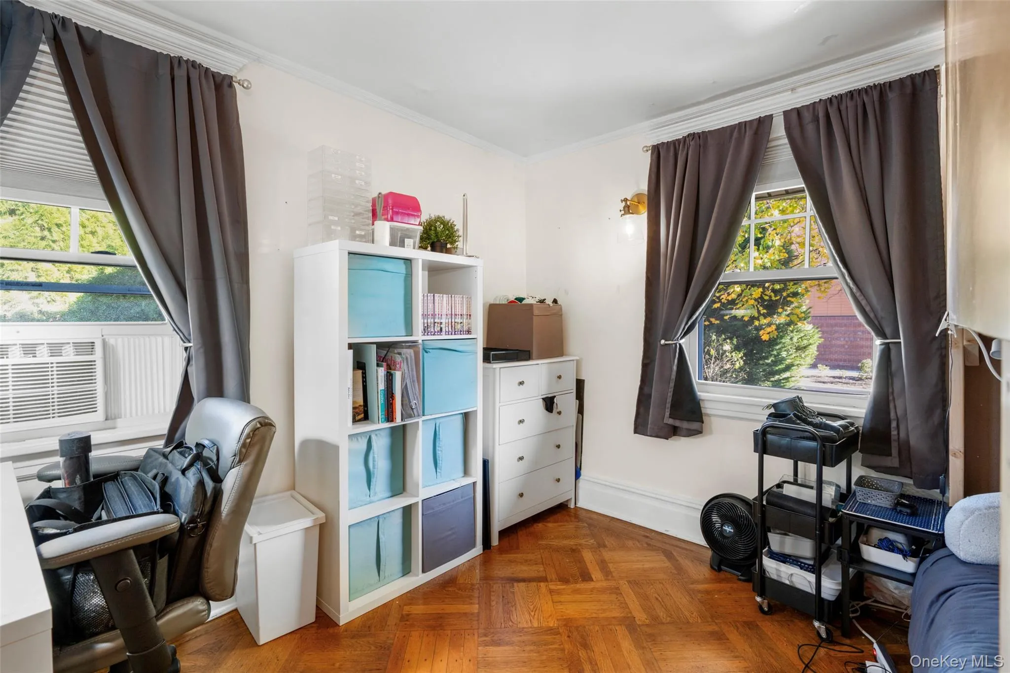 Office area with parquet flooring, cooling unit, a healthy amount of sunlight, and crown molding Office area with parquet flooring, cooling unit, a healthy amount of sunlight, and crown molding