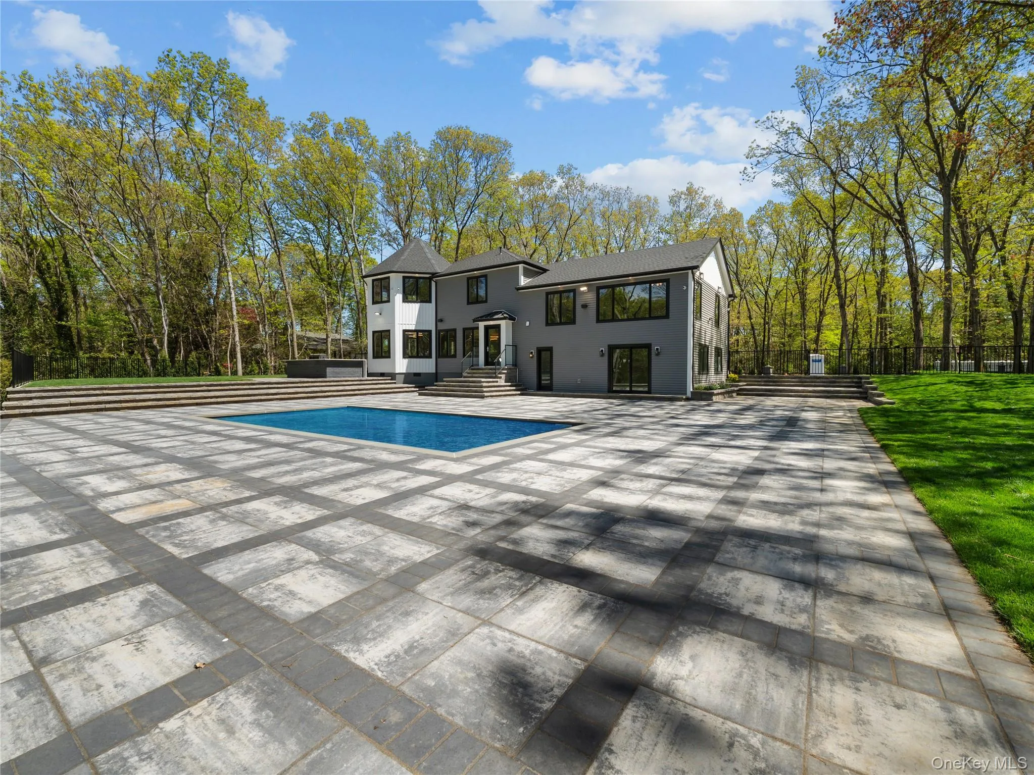 Rear view of property with a patio area Rear view of property with a patio area