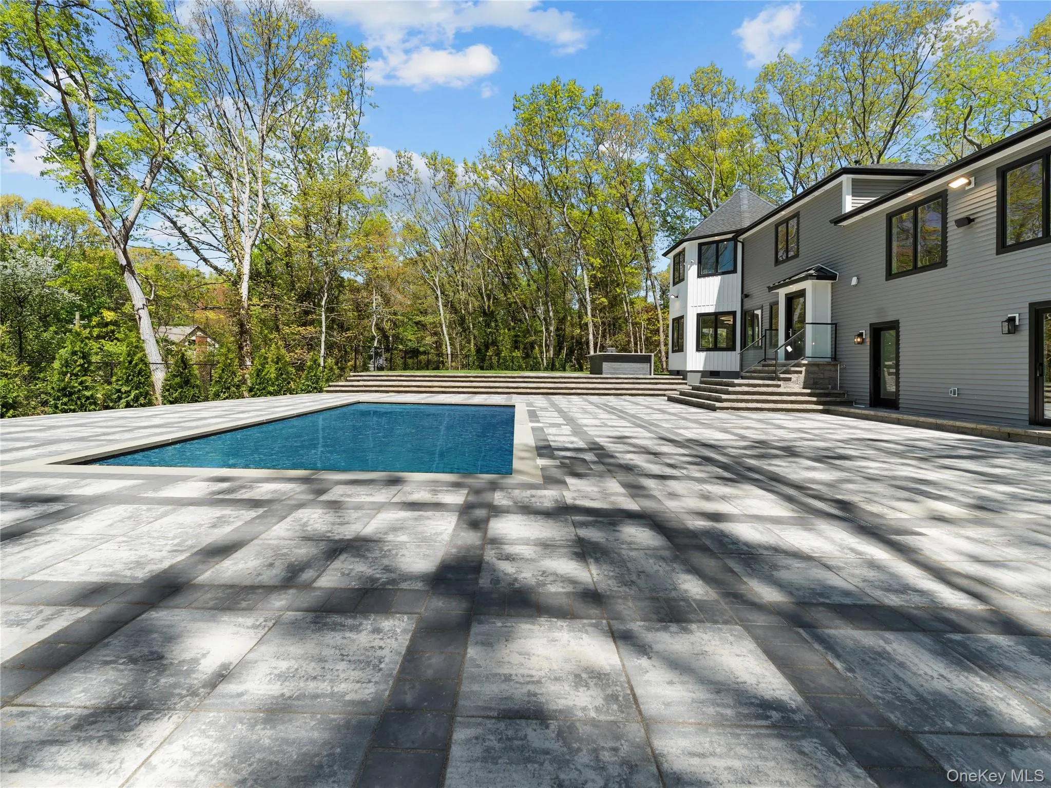 Outdoor pool with a patio Outdoor pool with a patio