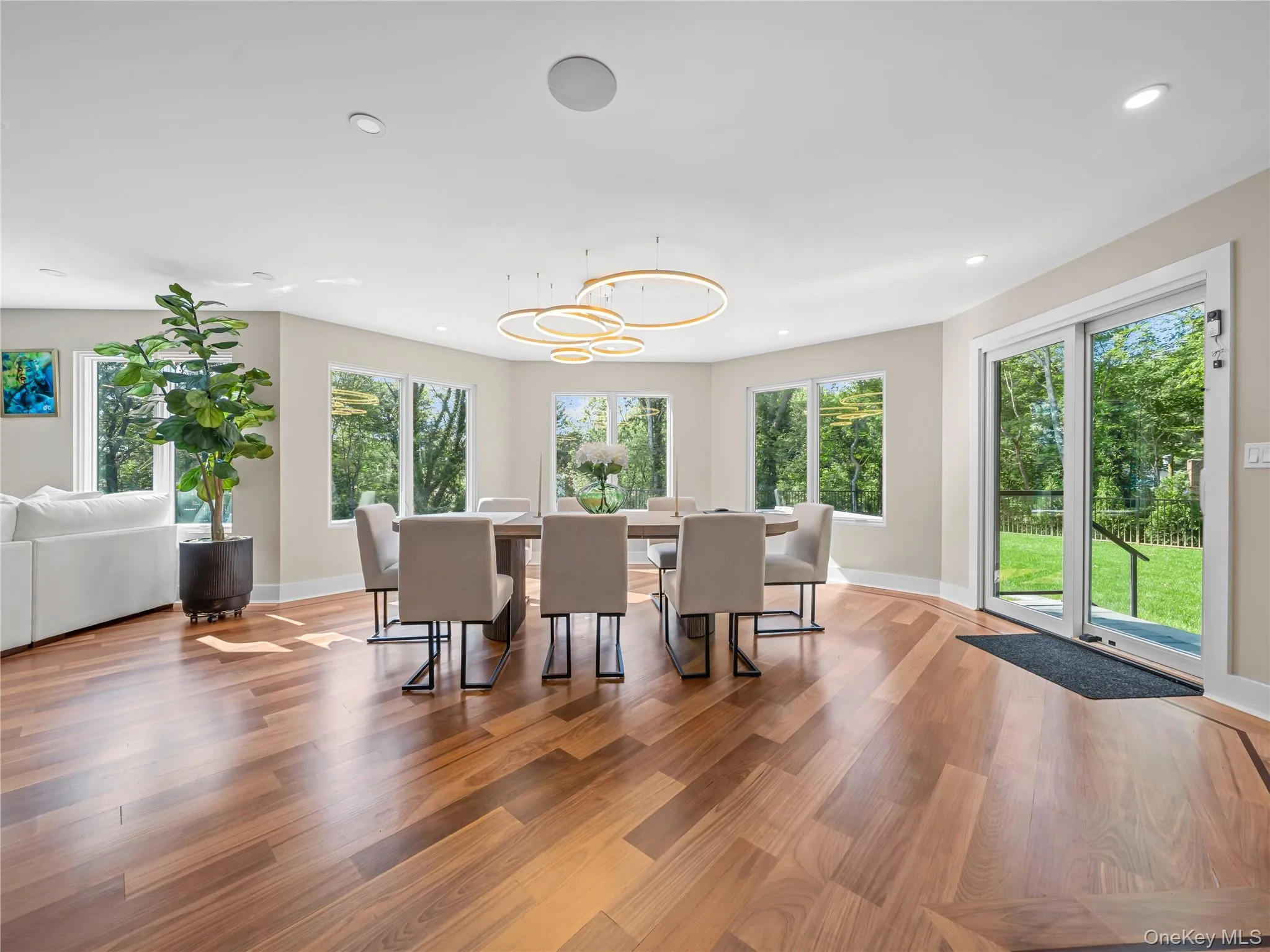 Dining area with light wood-style floors and recessed lighting Dining area with light wood-style floors and recessed lighting