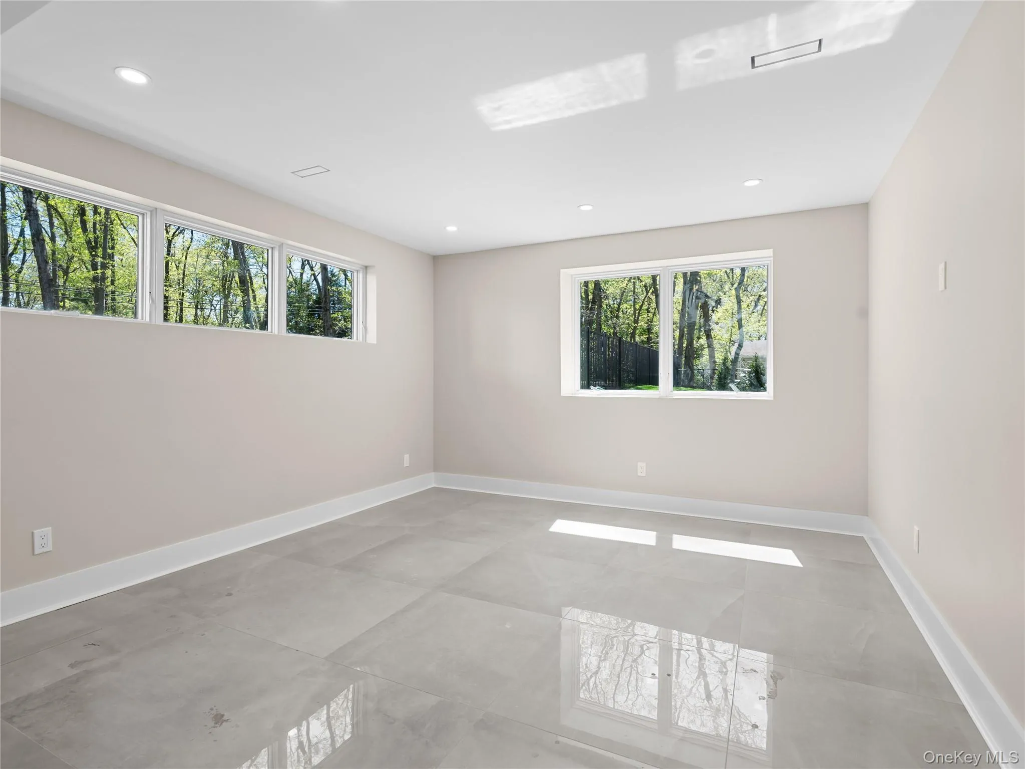 Spare room featuring plenty of natural light and recessed lighting Spare room featuring plenty of natural light and recessed lighting
