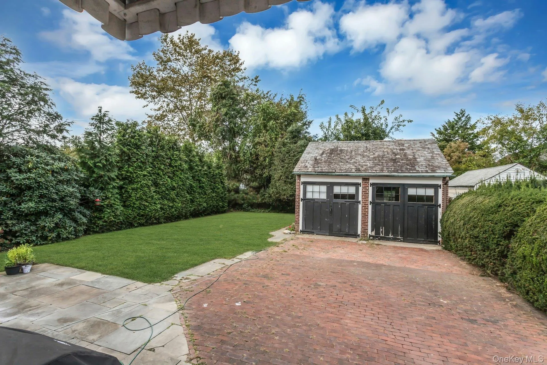 Detached two-car garage with brick construction Detached two-car garage with brick construction