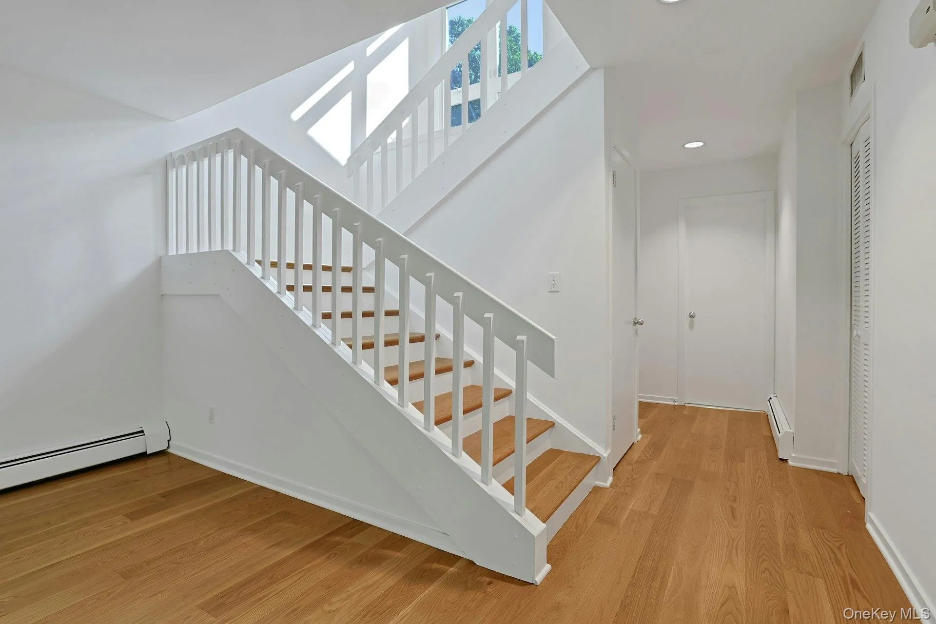 Inside, there is an updated hall bath just next to the entrance. A coat closet and deep, under-stair storage area make keeping this space neat a breeze. The stairs lead up to the light-filled second floor, with soaring ceilings. Inside, there is an updated hall bath just next to the entrance. A coat closet and deep, under-stair storage area make keeping this space neat a breeze. The stairs lead up to the light-filled second floor, with soaring ceilings.