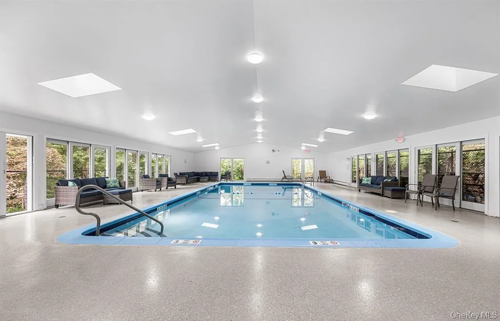 The large indoor community pool is protected from weather. Just a few steps from the home, this is an amazing amenity - literally in your backyard! The large indoor community pool is protected from weather. Just a few steps from the home, this is an amazing amenity - literally in your backyard!