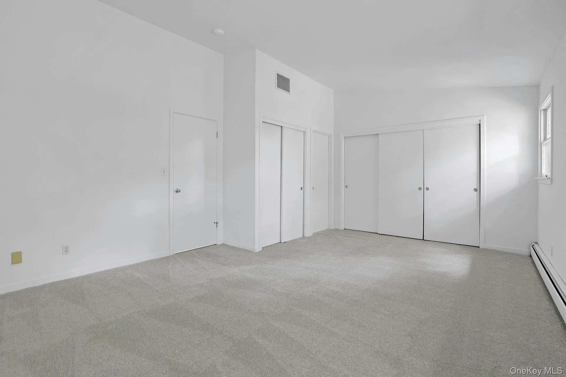 Extensive closets in the primary bedroom make storage easy. There is space for every season. Extensive closets in the primary bedroom make storage easy. There is space for every season.
