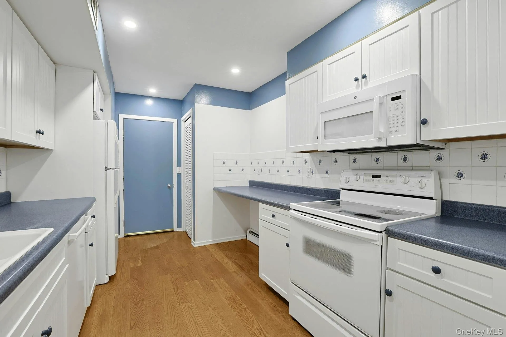 The beautiful ceramic tile backsplash makes cleaning easier and cabinets throughout the kitchen allow for abundant storage. There is space for every implement you can think of. The beautiful ceramic tile backsplash makes cleaning easier and cabinets throughout the kitchen allow for abundant storage. There is space for every implement you can think of.