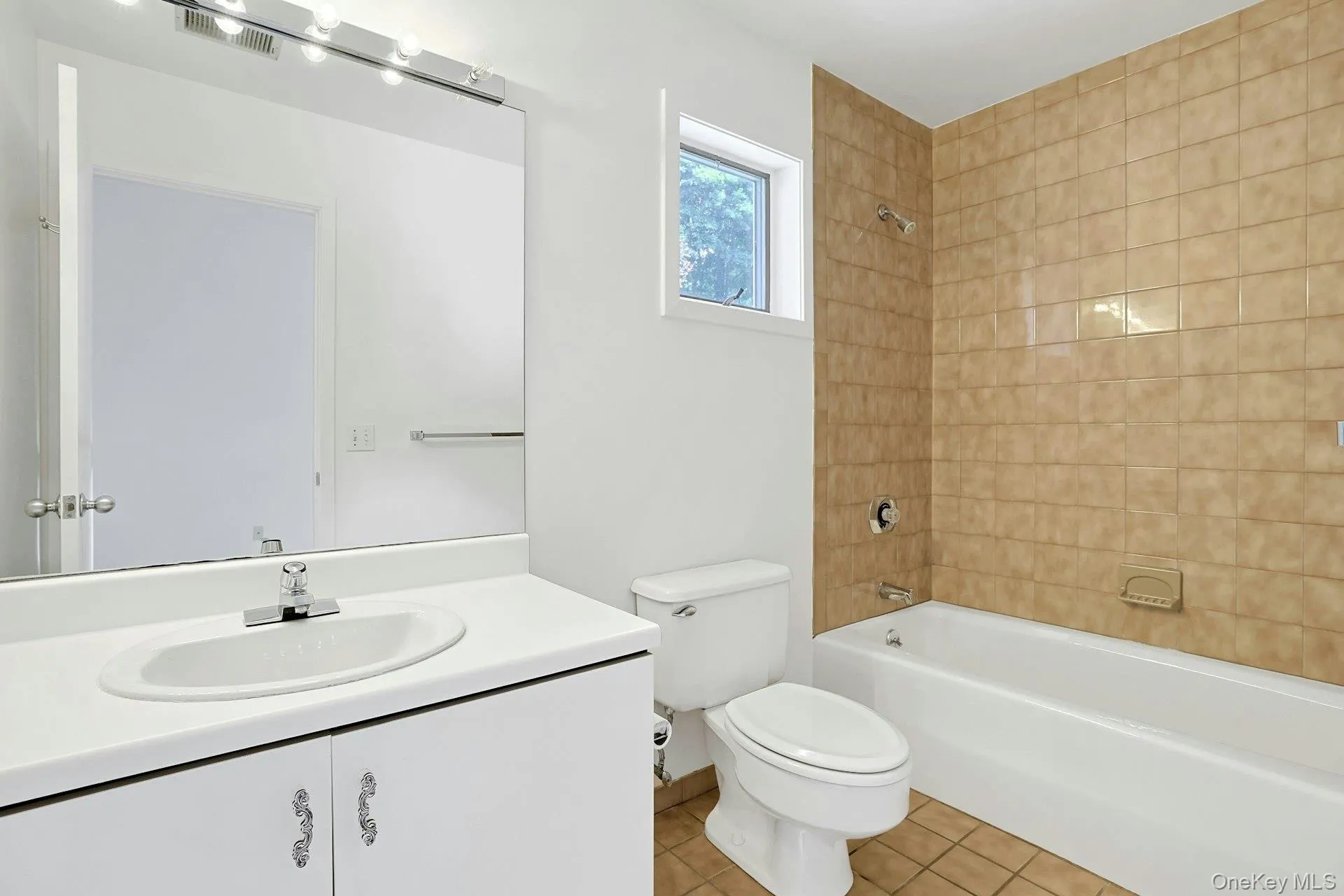 The private ensuite bathroom of the second bedroom is also tiled and has its own tub/shower. Whether for family or guests, this extra bathroom is a wonderful addition. The private ensuite bathroom of the second bedroom is also tiled and has its own tub/shower. Whether for family or guests, this extra bathroom is a wonderful addition.