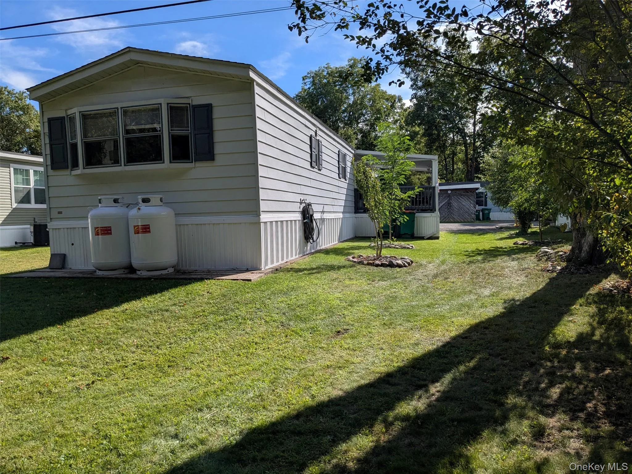 Back of Home, with nice side yard. Back of Home, with nice side yard.