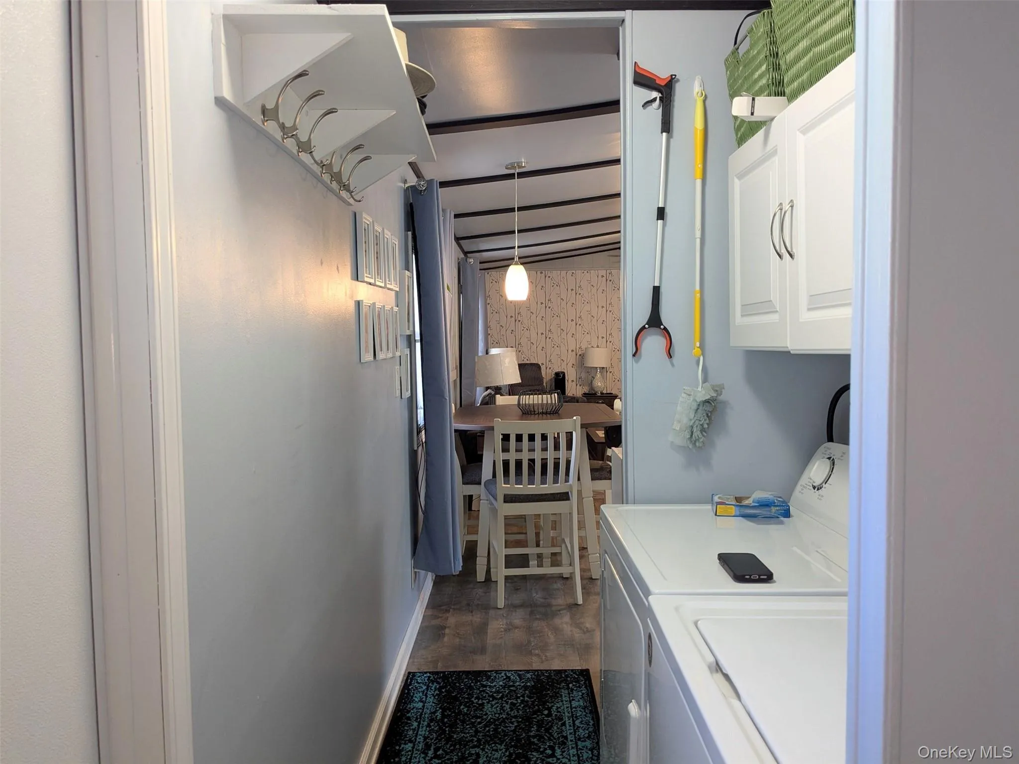 Hall to MBR with laundry, full Bath and back door.Extra room to hang coats Hall to MBR with laundry, full Bath and back door.Extra room to hang coats