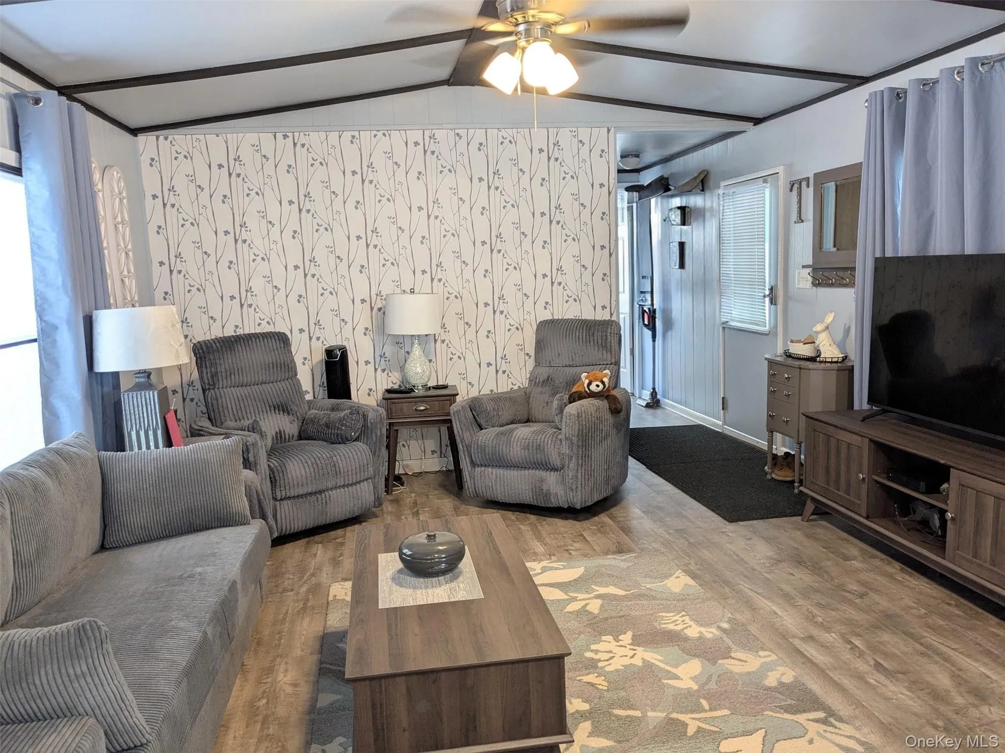 Large living room with room for extra seating. Large living room with room for extra seating.
