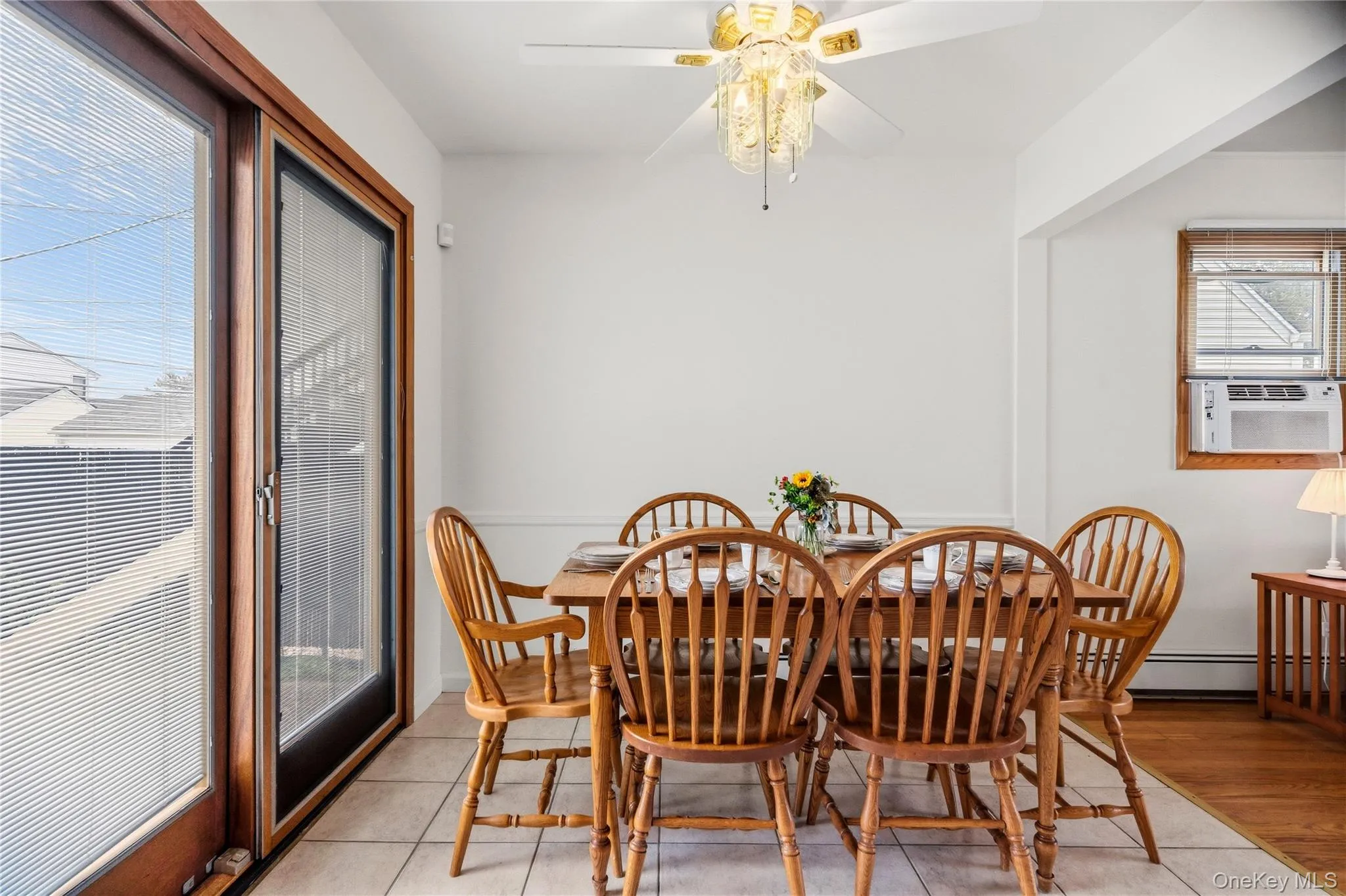 The eat-in kitchen's breakfast nook provides an area for a sizable table, and also features sliding doors out to the backyard and detached garage. The eat-in kitchen's breakfast nook provides an area for a sizable table, and also features sliding doors out to the backyard and detached garage.
