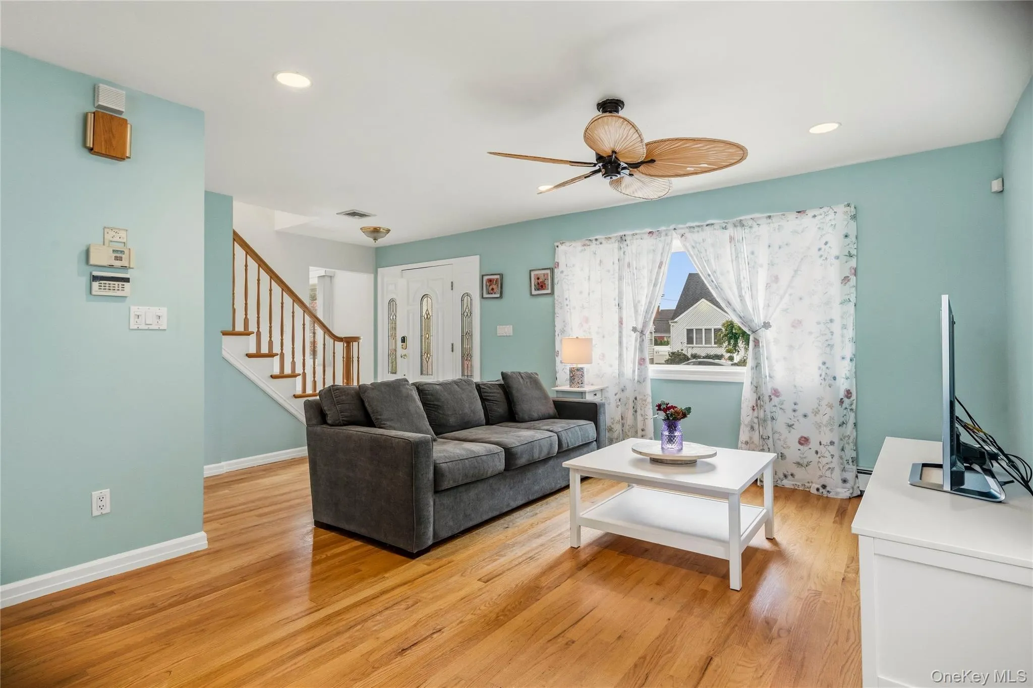 The front end of the living room is open to the entrance foyer and is set up for casual seating and enjoying television. The front end of the living room is open to the entrance foyer and is set up for casual seating and enjoying television.