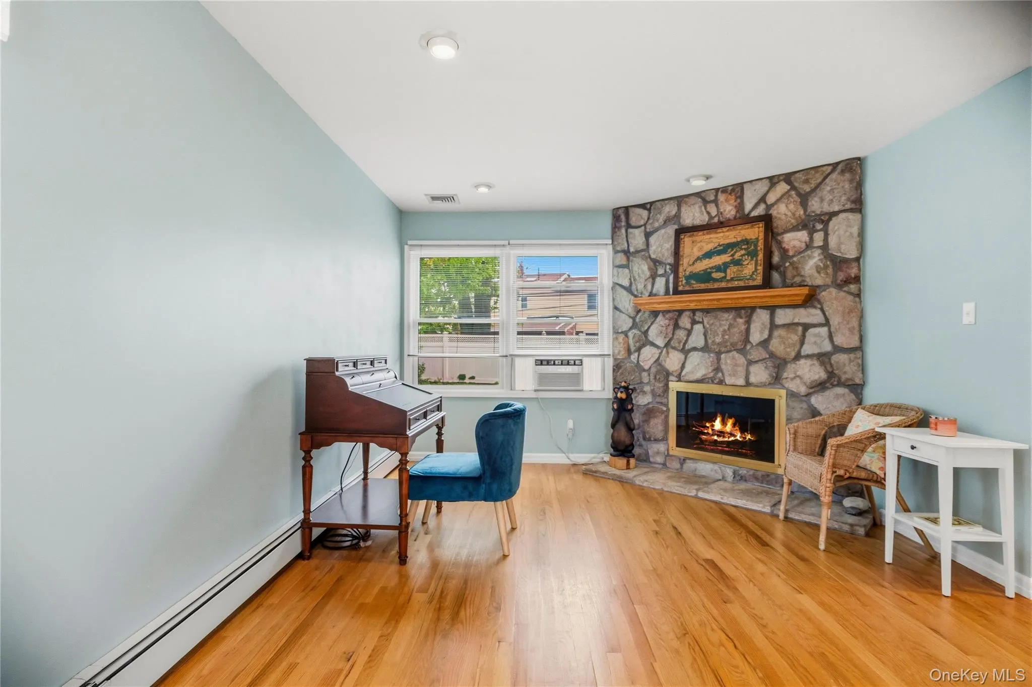 The back end of the living room has an additional gathering space to enjoy the fireplace. The back end of the living room has an additional gathering space to enjoy the fireplace.