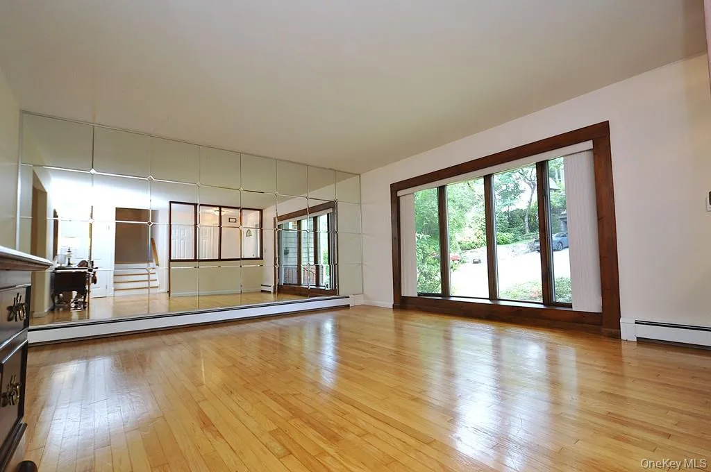 Living Room has a bay window, hardwood floors and opens to the dining room. Living room is approx 16'-6" x 14'-11" Living Room has a bay window, hardwood floors and opens to the dining room. Living room is approx 16'-6" x 14'-11"