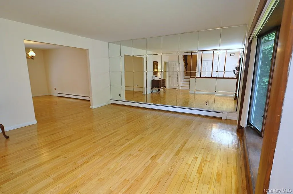 Living Room has a bay window, hardwood floors and opens to the dining room. Living room is approx 16'-6" x 14'-11" Living Room has a bay window, hardwood floors and opens to the dining room. Living room is approx 16'-6" x 14'-11"