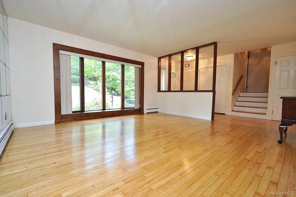 Living Room has a bay window, hardwood floors and opens to the dining room. Living room is approx 16'-6" x 14'-11" Living Room has a bay window, hardwood floors and opens to the dining room. Living room is approx 16'-6" x 14'-11"