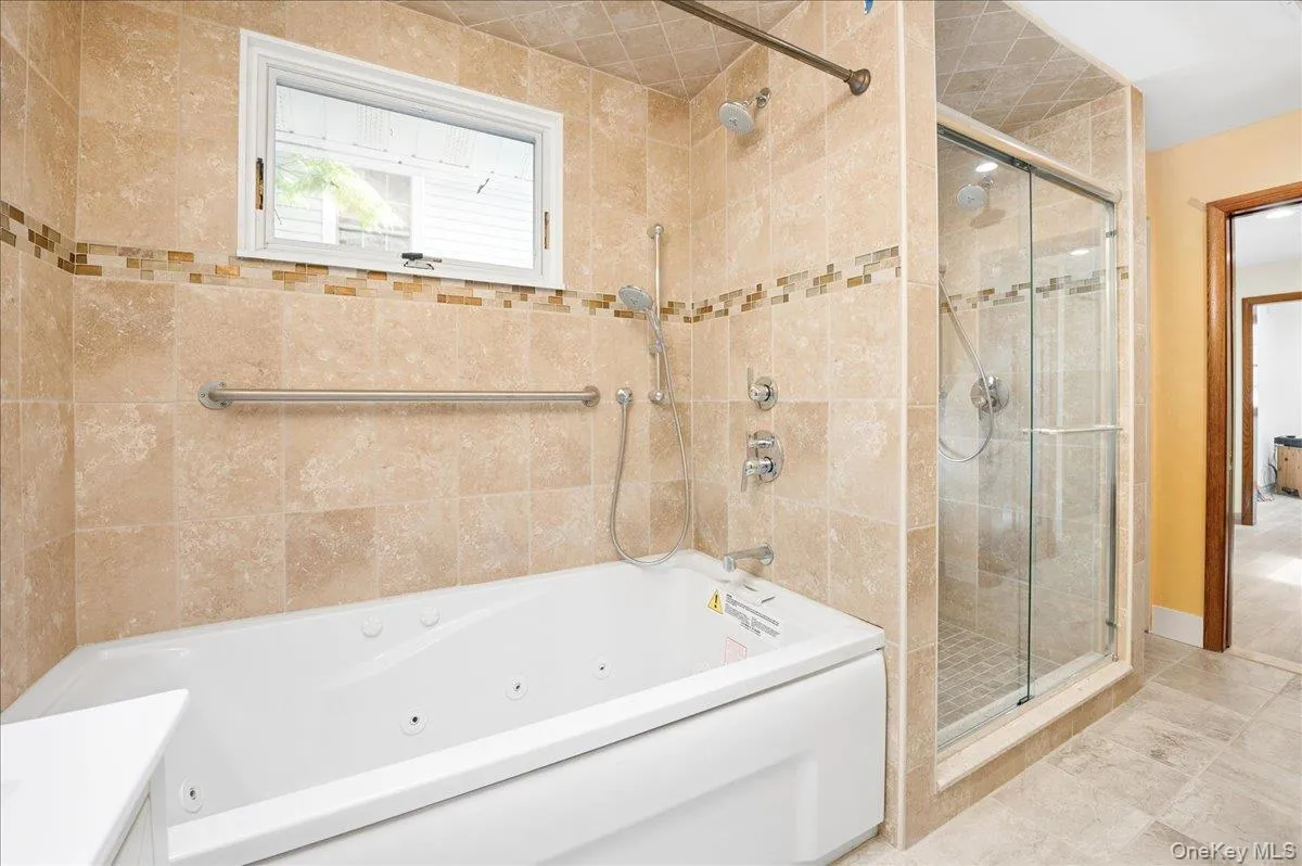Fully renovated bathroom with Jacuzzi and shower Fully renovated bathroom with Jacuzzi and shower