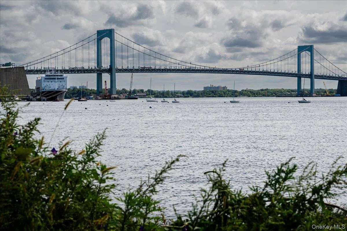 Waterfront view of bridge, private beach. Waterfront view of bridge, private beach.