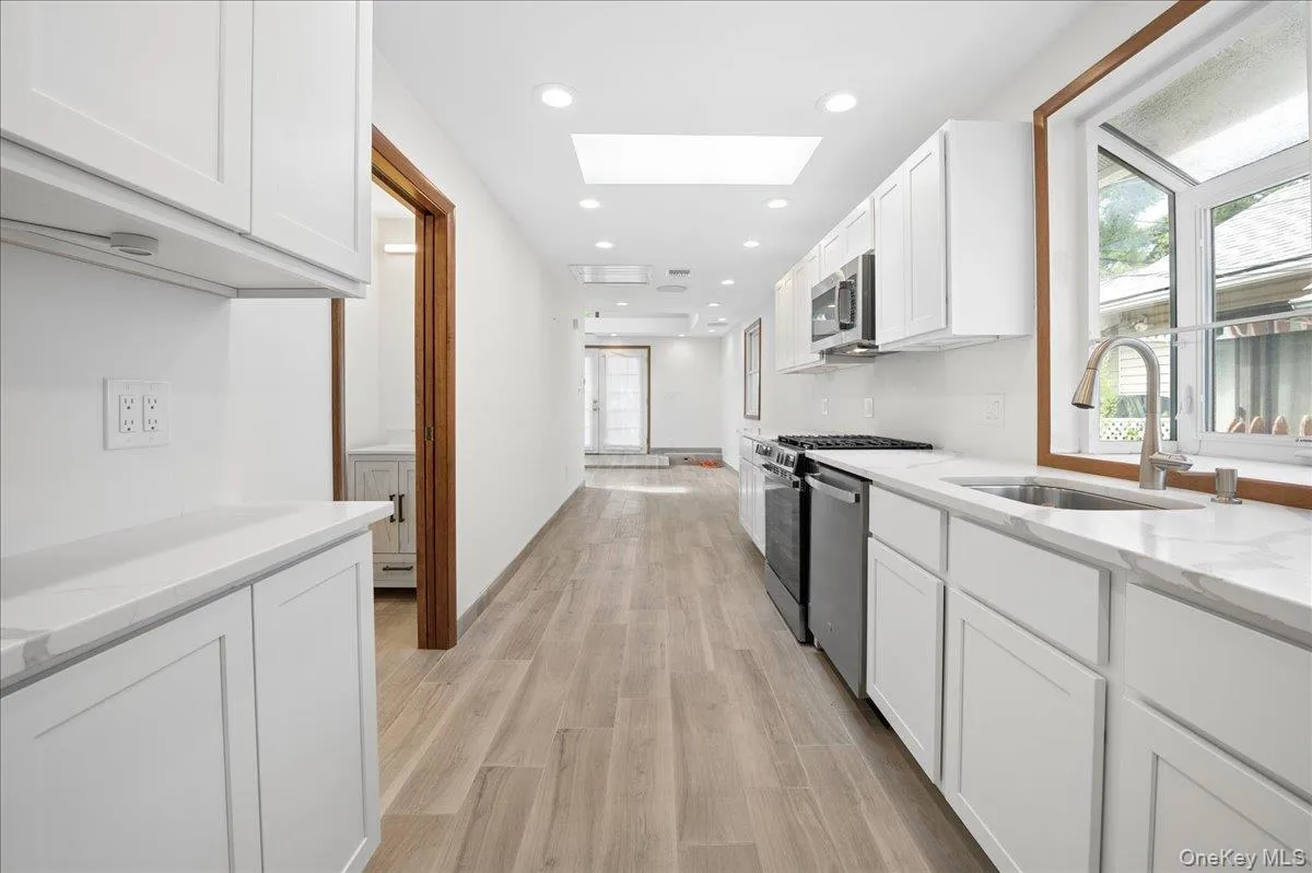 Fully renovated kitchen with lots of cabinets quartz countertops. Fully renovated kitchen with lots of cabinets quartz countertops.