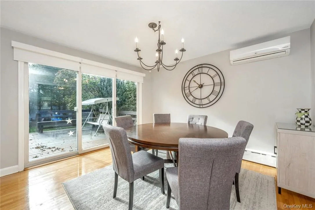 Formal Dining Room with Door to Large Deck and Backyard. Formal Dining Room with Door to Large Deck and Backyard.