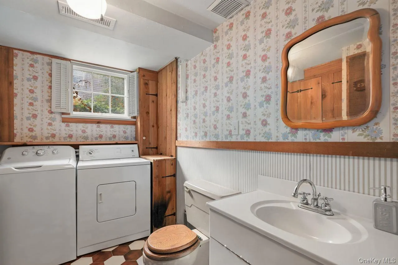 Lower level, laundry room and half bathroom Lower level, laundry room and half bathroom