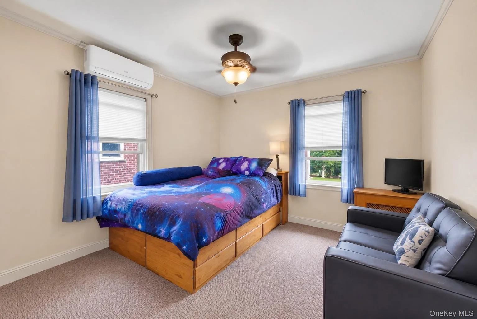 Neutral wall tones with crown molding, ceiling fan, and carpeted flooring Neutral wall tones with crown molding, ceiling fan, and carpeted flooring
