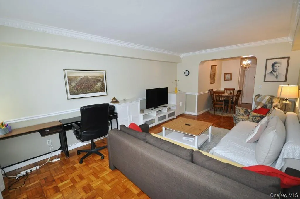 Large Living Room opens to the Dining area and has parquet floors. Large Living Room opens to the Dining area and has parquet floors.