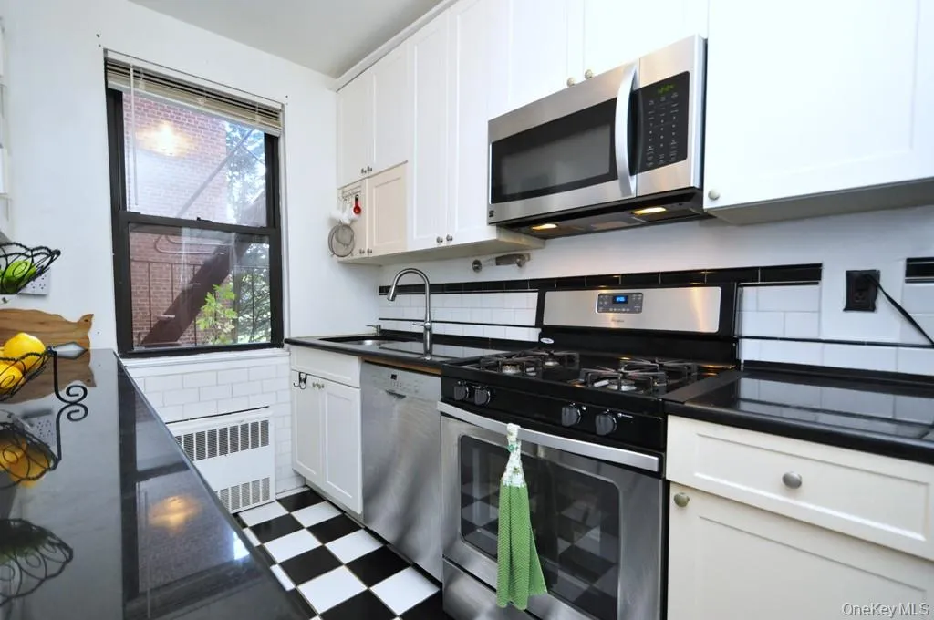 Updated kitchen has granite counters and stainless steel appliances. Updated kitchen has granite counters and stainless steel appliances.