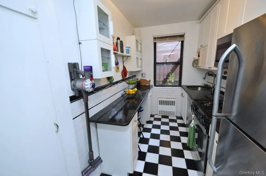 Updated kitchen has granite counters and stainless steel appliances. Updated kitchen has granite counters and stainless steel appliances.