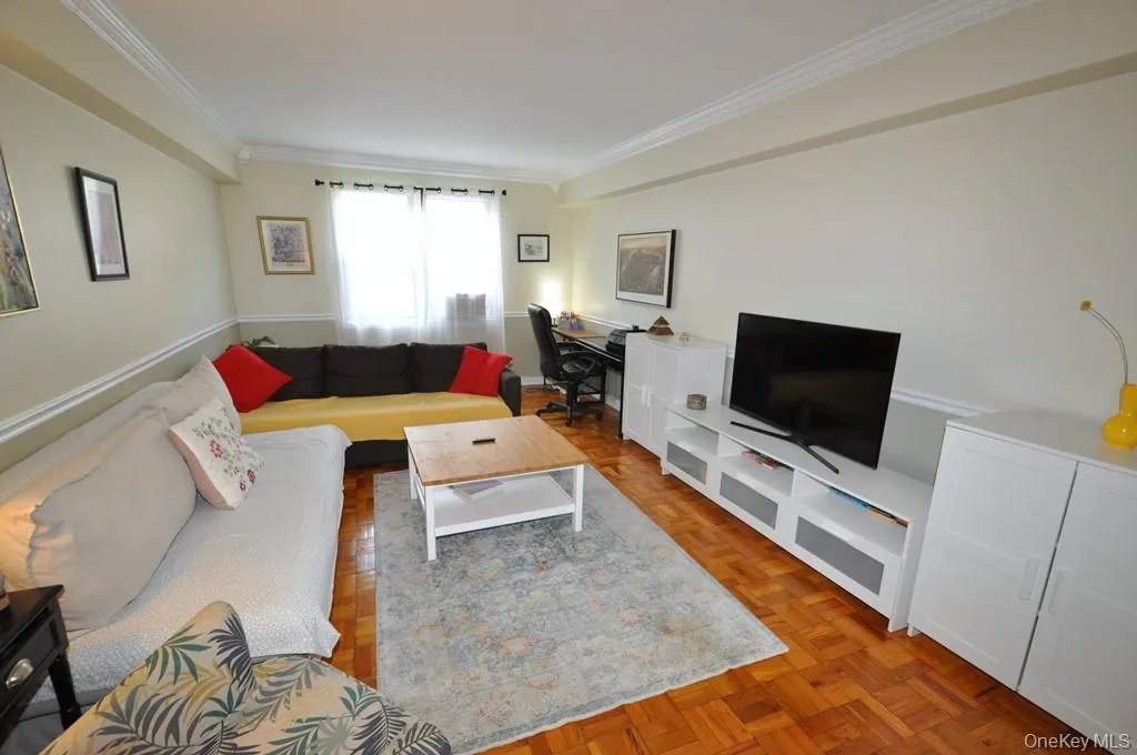 Large Living Room opens to the Dining area and has parquet floors. Large Living Room opens to the Dining area and has parquet floors.