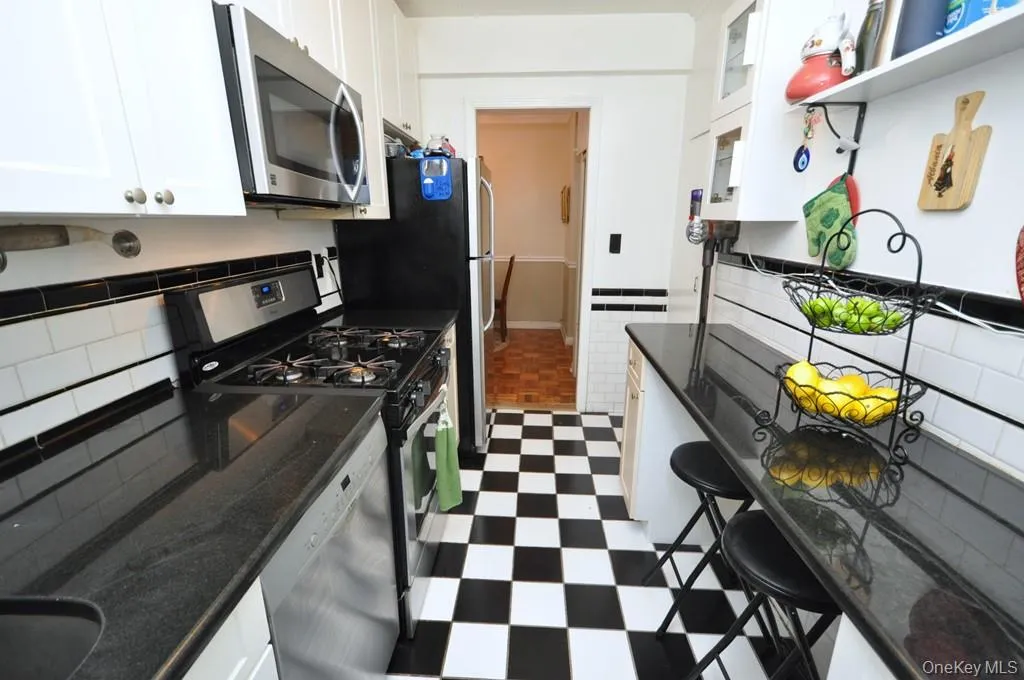 Updated kitchen has granite counters and stainless steel appliances. Updated kitchen has granite counters and stainless steel appliances.
