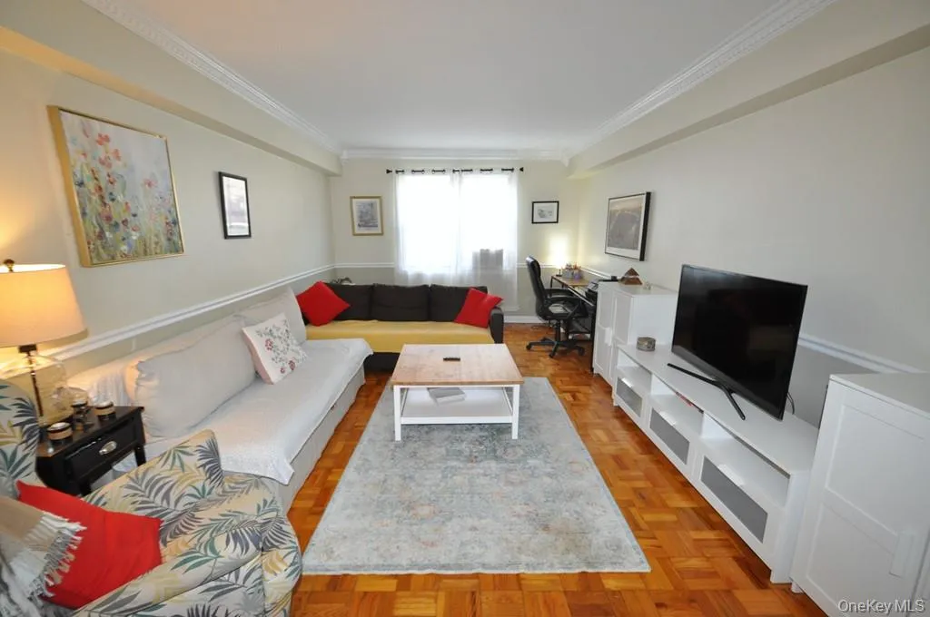Large Living Room opens to the Dining area and has parquet floors. Large Living Room opens to the Dining area and has parquet floors.