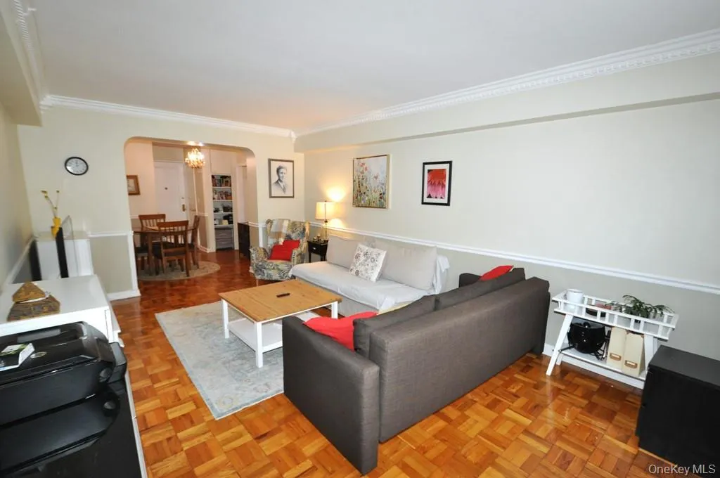 Large Living Room opens to the Dining area and has parquet floors. Large Living Room opens to the Dining area and has parquet floors.