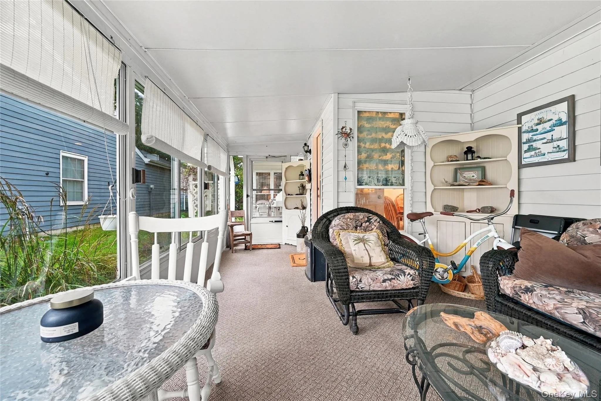 Enjoy your days relaxing overlooking gardens from walls of windows in sunroom. Enjoy your days relaxing overlooking gardens from walls of windows in sunroom.