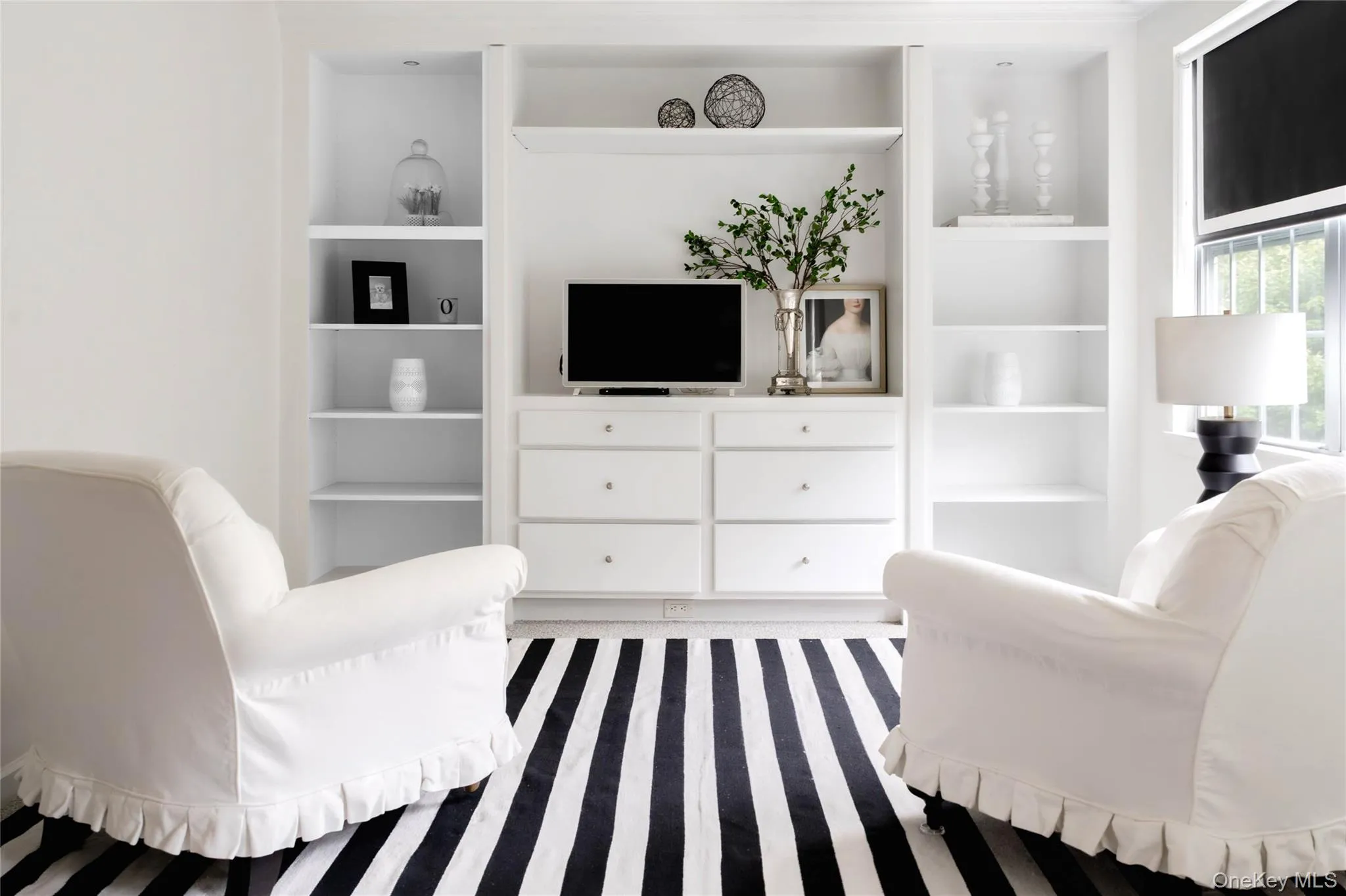 Seating area with built-ins in primary bedroom Seating area with built-ins in primary bedroom