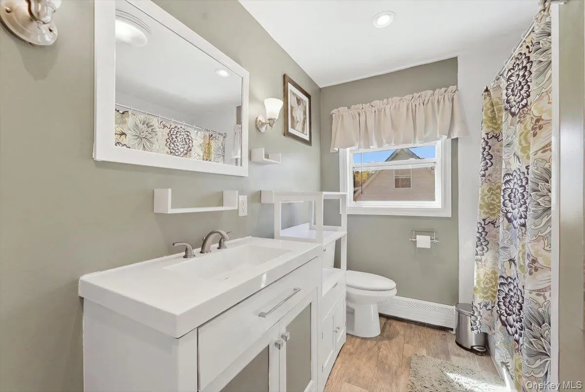 Large bathroom with hidden washer and dryer Large bathroom with hidden washer and dryer