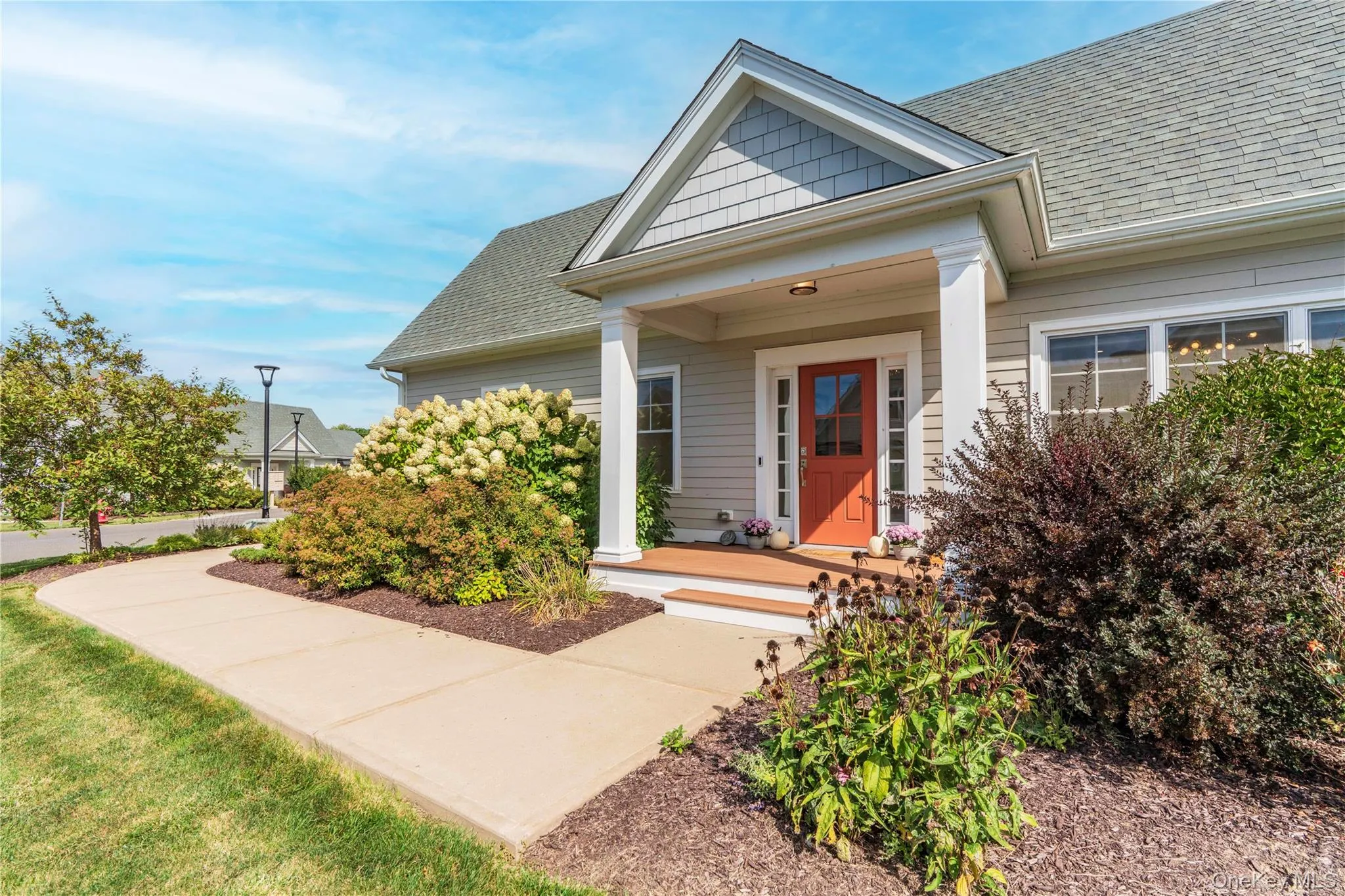 Landscaped Walkway to Entrance with Perennial Gardens Landscaped Walkway to Entrance with Perennial Gardens