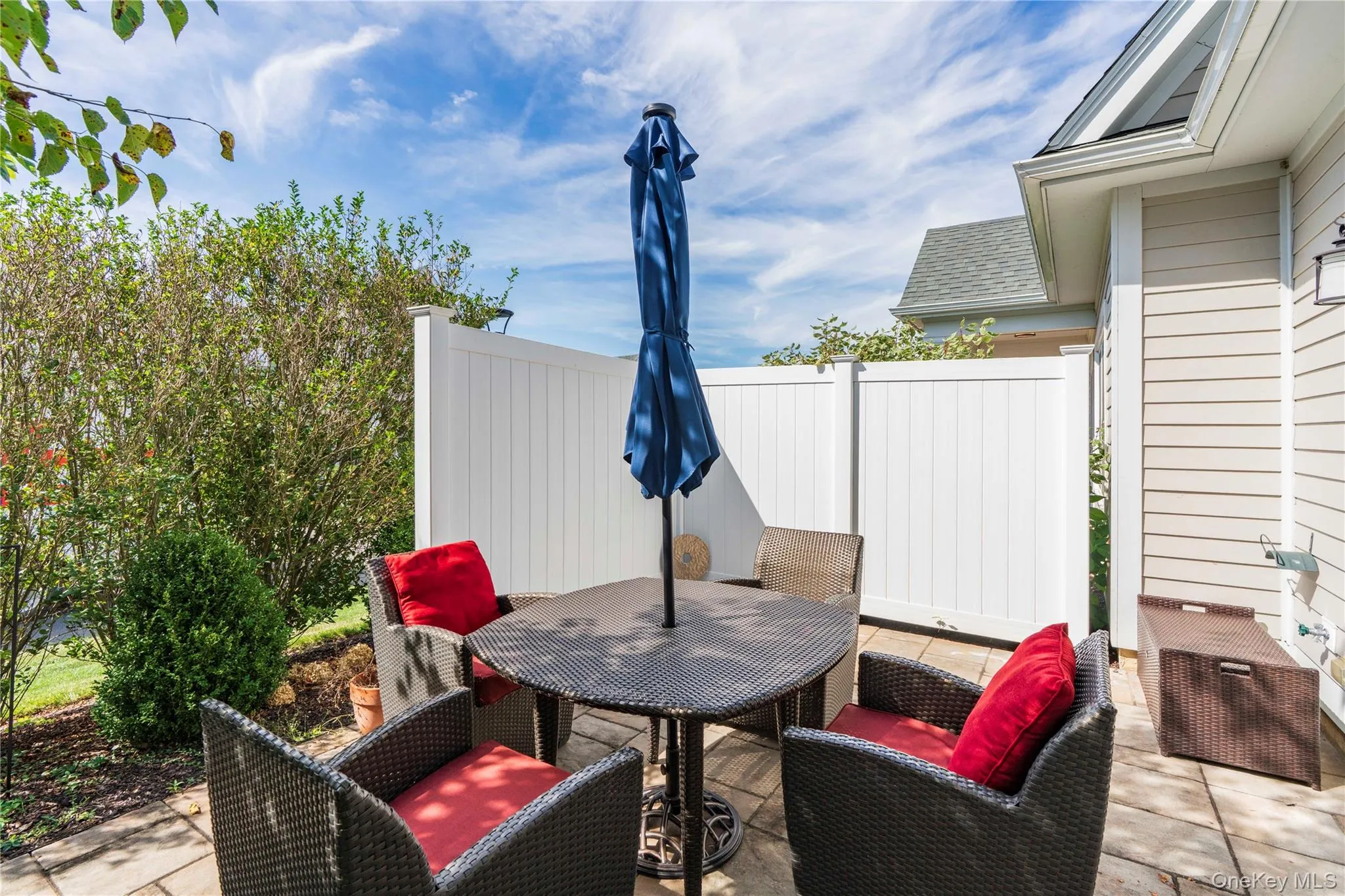 Sunny Private Patio Area with Stone Pavers Sunny Private Patio Area with Stone Pavers